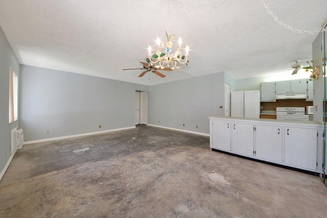 unfurnished living room with concrete flooring, a textured ceiling, and ceiling fan with notable chandelier