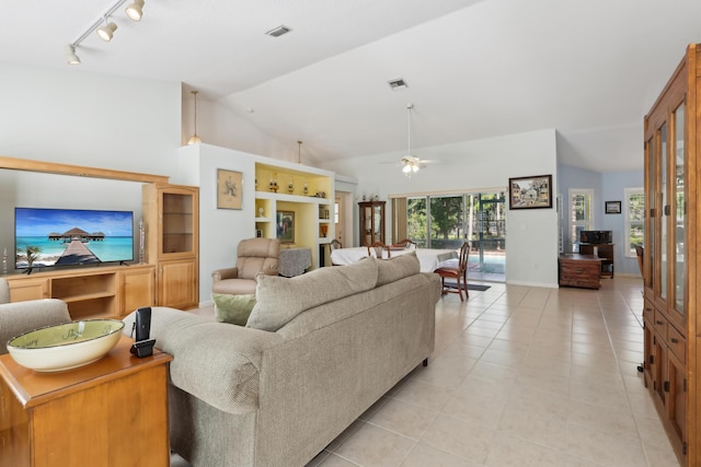 tiled living room featuring lofted ceiling and ceiling fan