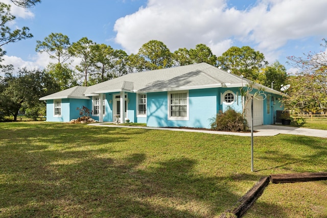 ranch-style house with a front yard and a garage