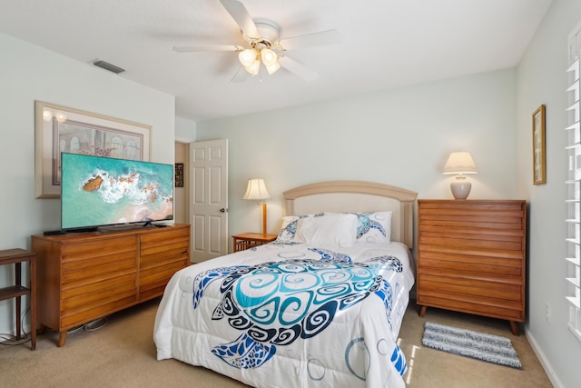 bedroom with ceiling fan and carpet