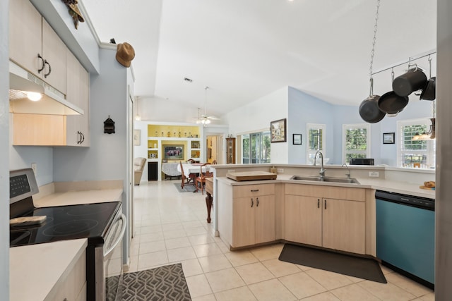 kitchen featuring appliances with stainless steel finishes, light brown cabinets, light tile patterned flooring, lofted ceiling, and sink