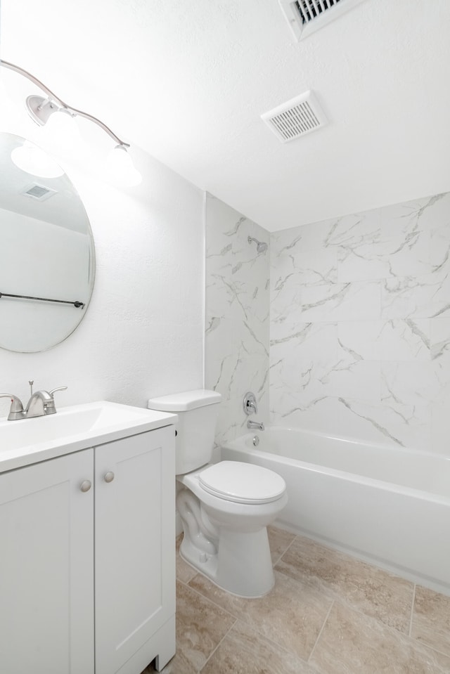 full bathroom featuring vanity, toilet, and tiled shower / bath combo