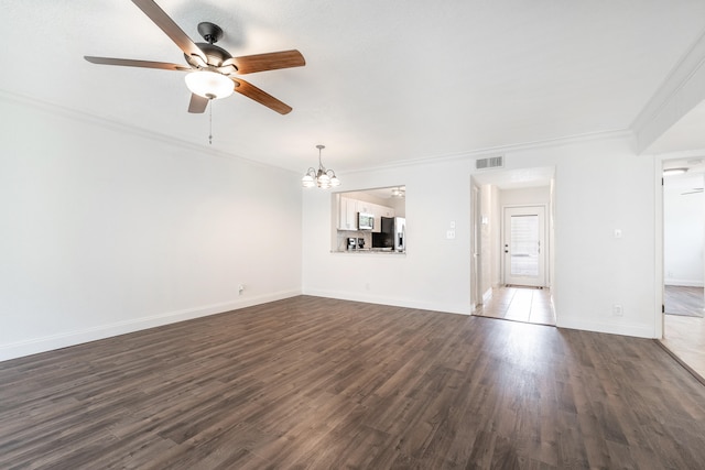 unfurnished living room featuring crown molding, dark hardwood / wood-style flooring, and ceiling fan with notable chandelier