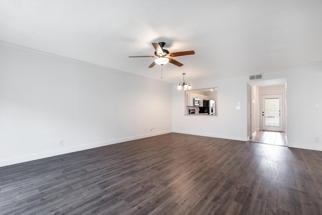 unfurnished living room with ornamental molding, ceiling fan with notable chandelier, and dark wood-type flooring