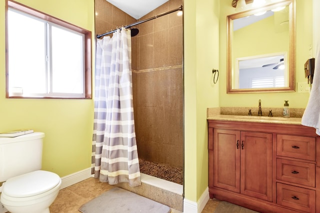 bathroom featuring toilet, vanity, tile patterned floors, and a shower with curtain