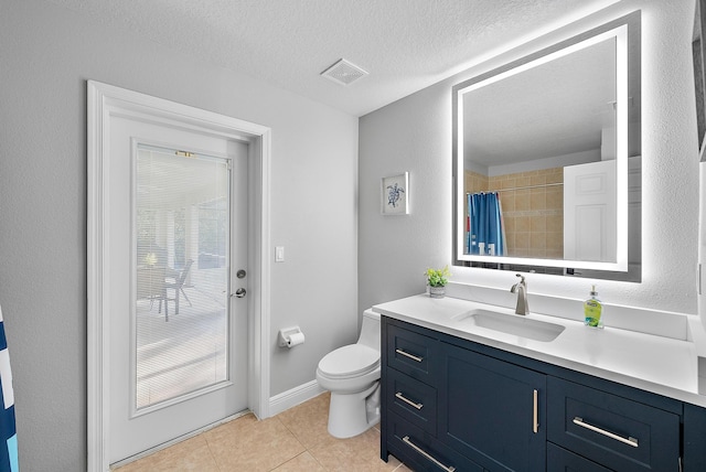 bathroom with vanity, toilet, tile patterned floors, a textured ceiling, and a shower with curtain