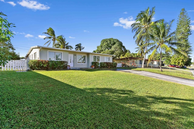 single story home featuring a front yard