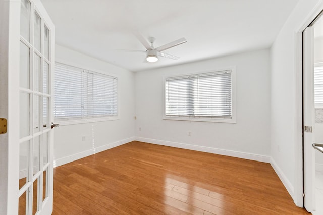 spare room featuring ceiling fan and light wood-type flooring