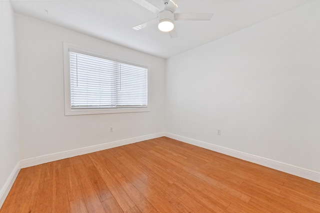 empty room featuring ceiling fan and hardwood / wood-style flooring