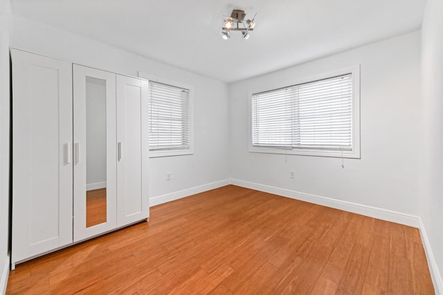 unfurnished bedroom featuring light wood-type flooring