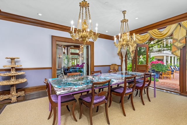 dining room featuring light wood-type flooring, an inviting chandelier, and crown molding