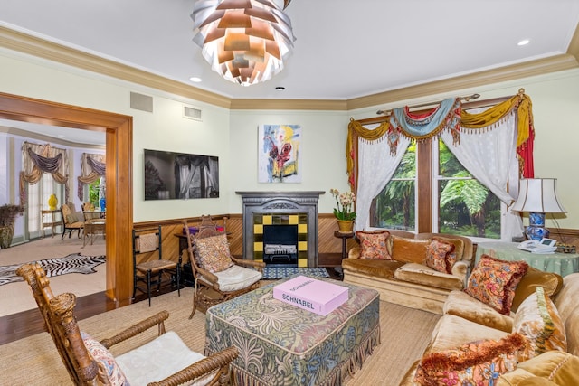 living room with hardwood / wood-style floors and ornamental molding