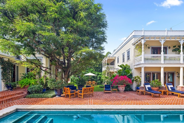 view of swimming pool with a patio