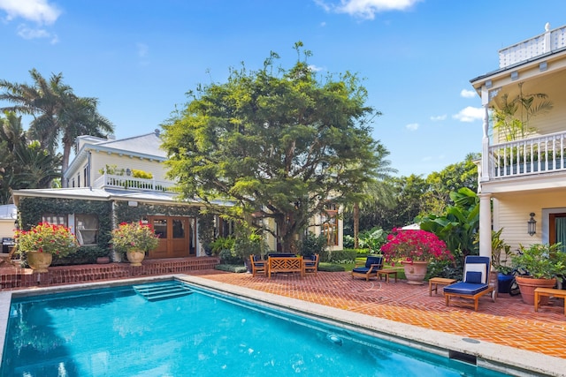 view of pool featuring a patio