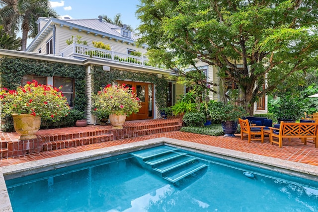 view of swimming pool with a patio and an outdoor hangout area