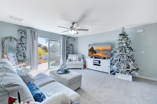 living room with light colored carpet and ceiling fan