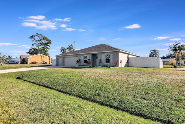 ranch-style house with a garage and a front lawn