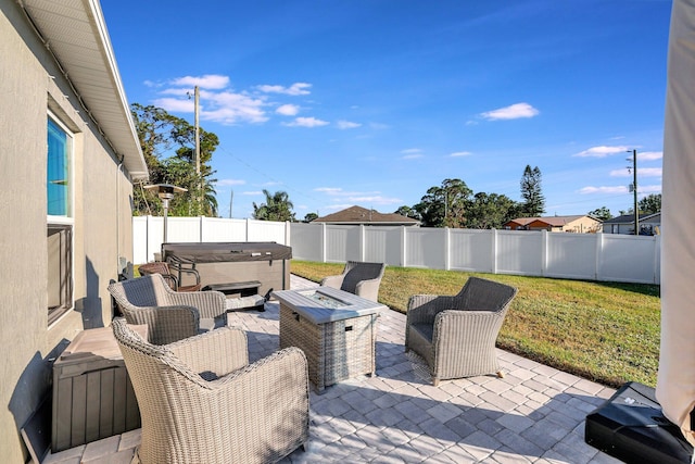 view of patio / terrace with a hot tub