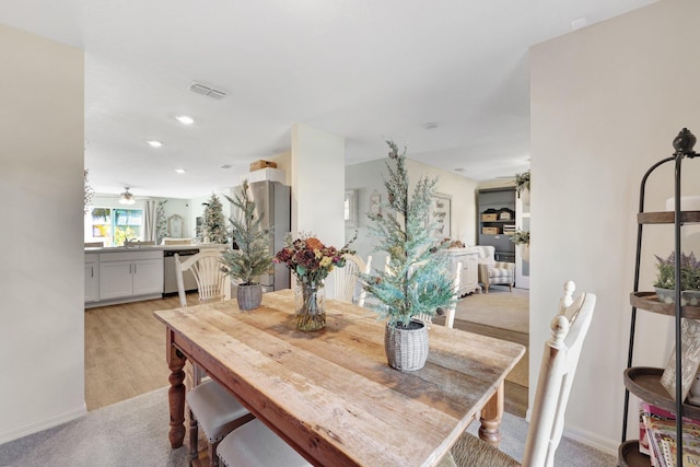 dining area featuring ceiling fan and light hardwood / wood-style floors