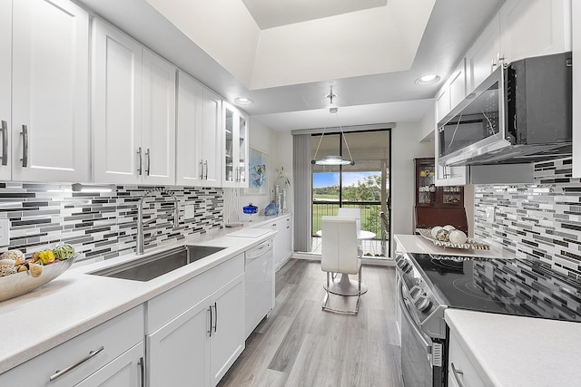 kitchen with white cabinets and appliances with stainless steel finishes