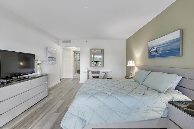 bedroom with light wood-type flooring