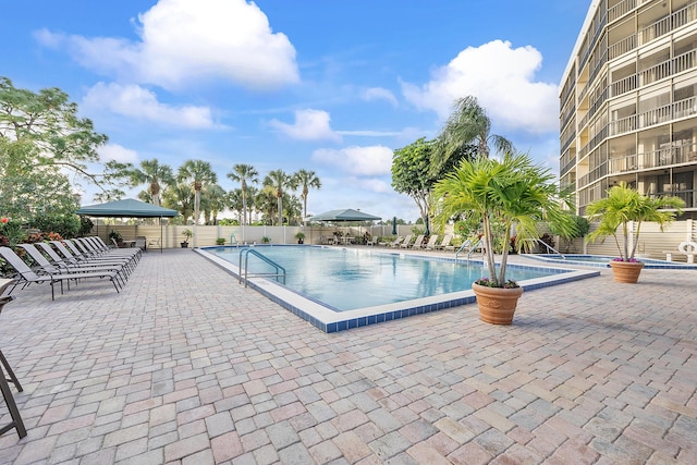 view of swimming pool with a gazebo and a patio area