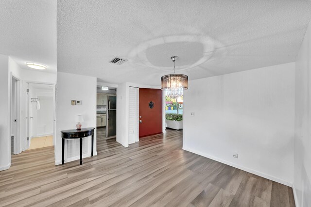 walk in closet with wood-type flooring