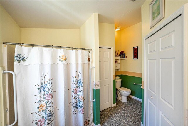 bathroom featuring tile patterned floors and toilet