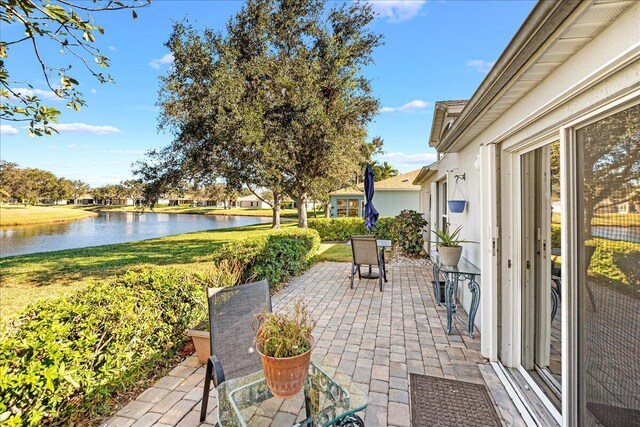 view of patio with a water view