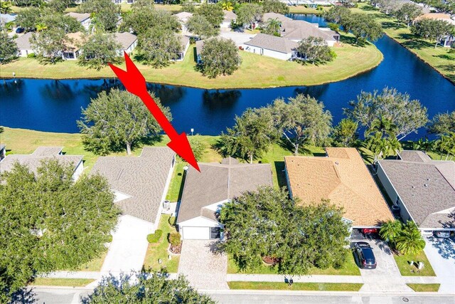 birds eye view of property featuring a water view