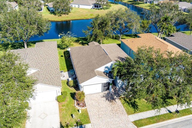 birds eye view of property with a water view