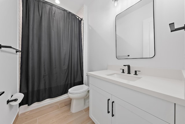 full bathroom with toilet, shower / bath combination with curtain, and vanity