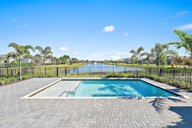 view of pool with a water view