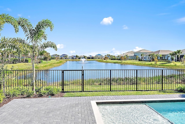 view of pool with a water view