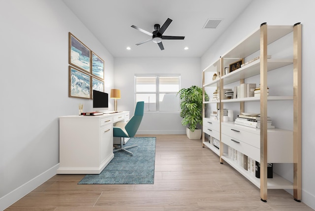 office featuring light wood-type flooring and ceiling fan