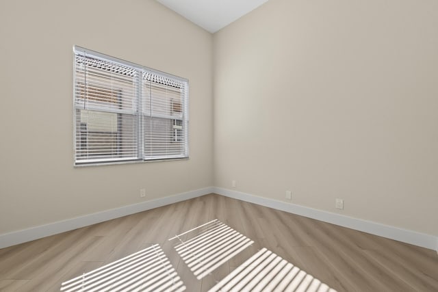 unfurnished room with light hardwood / wood-style flooring