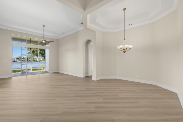 unfurnished room with light hardwood / wood-style flooring, ceiling fan with notable chandelier, and ornamental molding