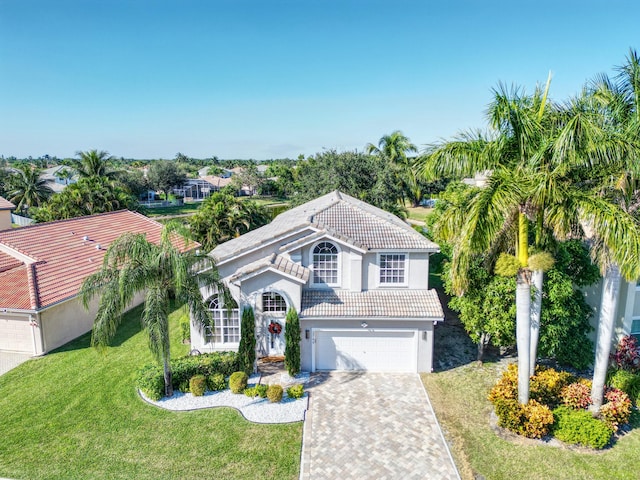 view of front facade with a garage and a front yard