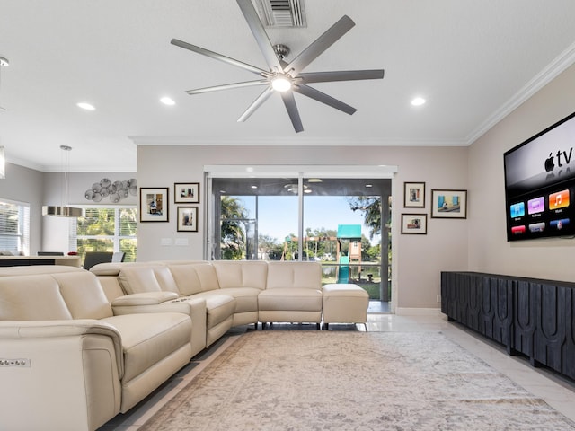 living room with ceiling fan and ornamental molding