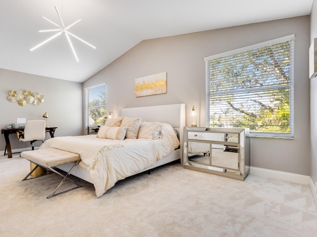 carpeted bedroom with lofted ceiling