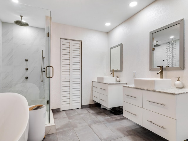 bathroom featuring vanity, an enclosed shower, and tile patterned flooring