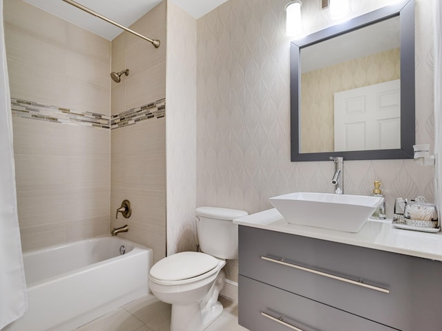 full bathroom with tiled shower / bath, vanity, toilet, and tile patterned flooring