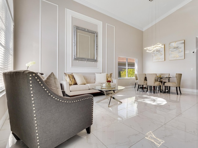 living area with a towering ceiling and crown molding