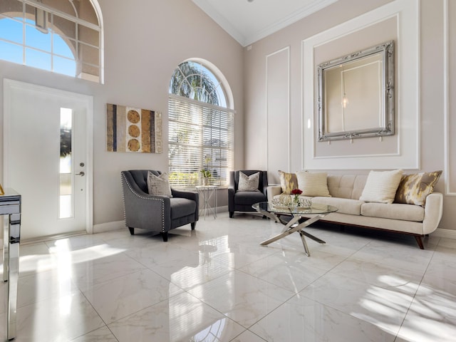 interior space with crown molding and high vaulted ceiling