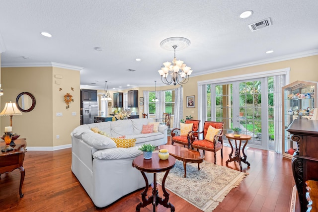 living room featuring dark hardwood / wood-style flooring, crown molding, and a wealth of natural light