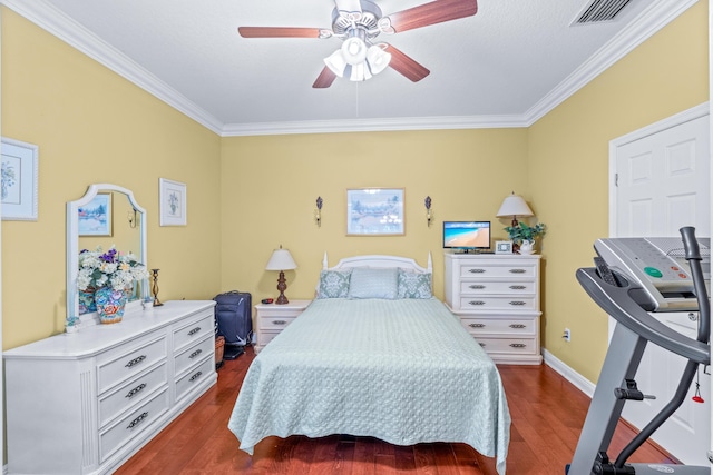 bedroom with dark hardwood / wood-style floors, ceiling fan, and ornamental molding