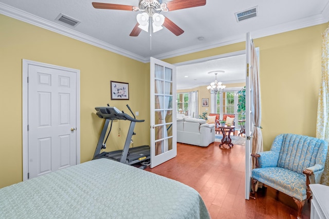 bedroom featuring french doors, hardwood / wood-style flooring, and ornamental molding