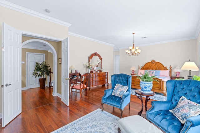 living area with a chandelier, dark hardwood / wood-style flooring, and crown molding