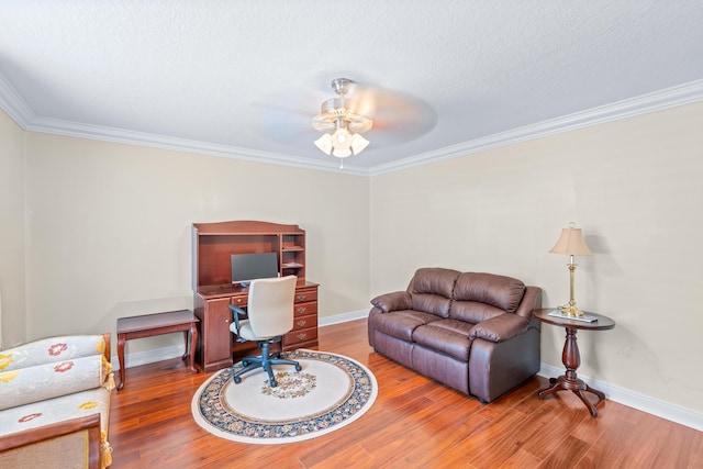 office with hardwood / wood-style floors, ceiling fan, and ornamental molding