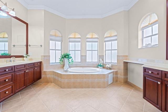 bathroom with tiled tub, ornamental molding, and a wealth of natural light